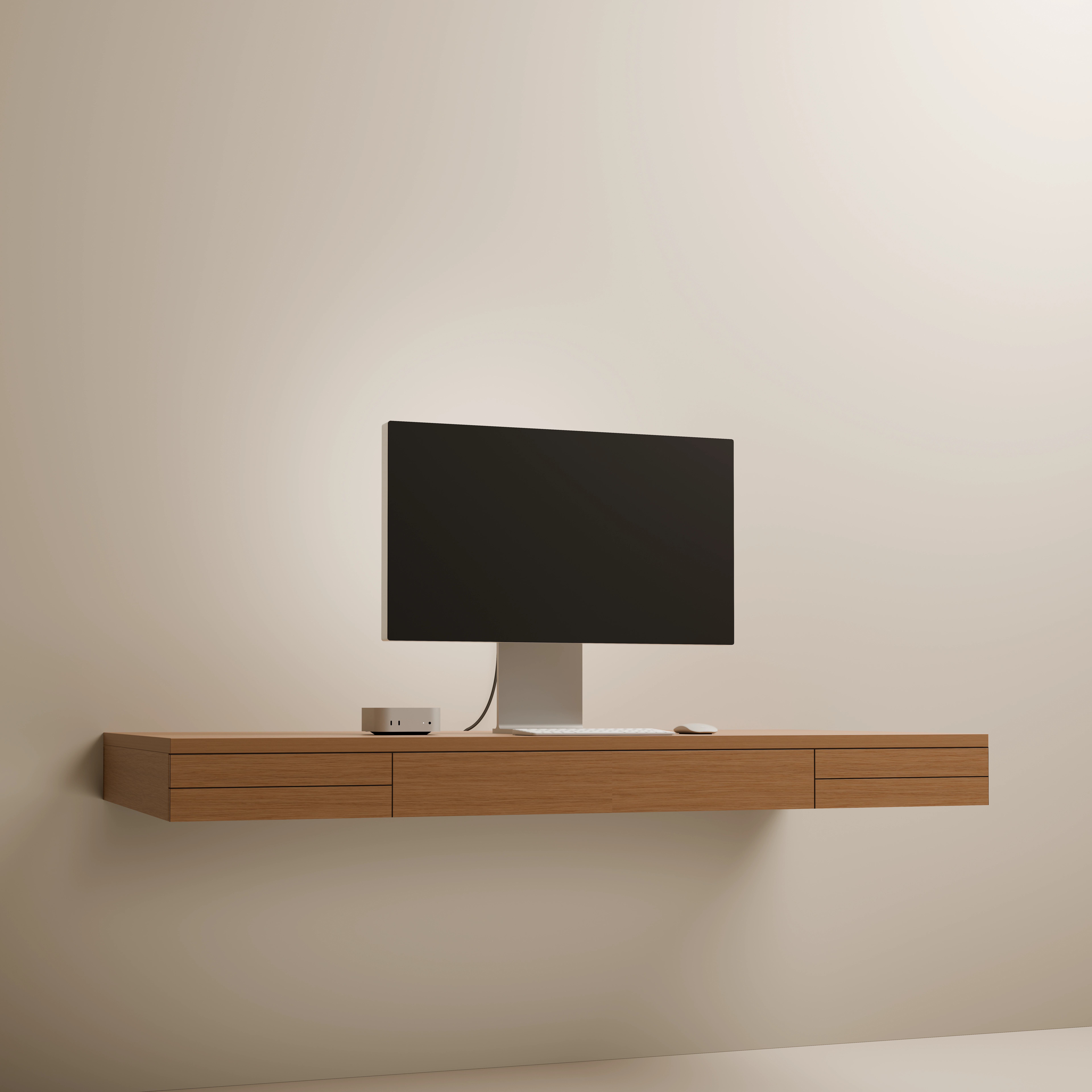 A floating oak desk with a silver monitor, Mac mini, keyboard and mouse